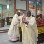 Rev. Father receiving Appreciation award